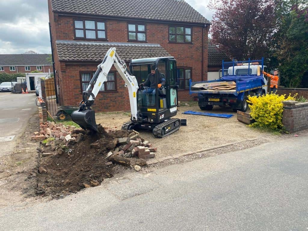 This is a photo of an operative of Norwich Driveway Contractors Digging out for a new tarmac driveway