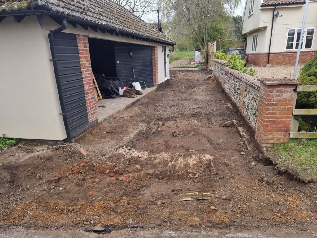 This is a tarmac driveway that is in the process of being dug out and installed by Norwich Driveway Contractors